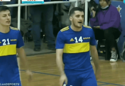 Man in Blue and Yellow Jersey Number 14