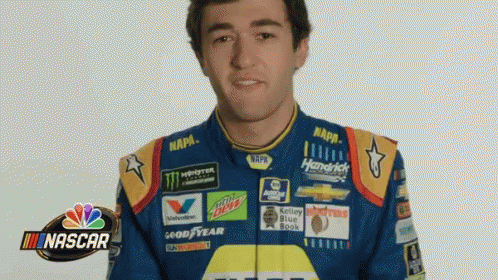 Man in Blue and Yellow NASCAR Jacket Making Funny Face