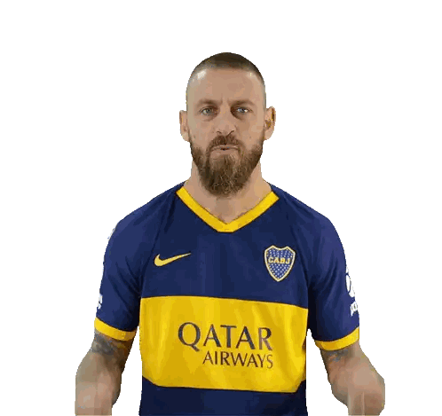 Man in Blue and Yellow Qatar Airways Jersey