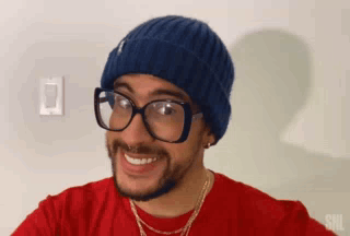Man in Blue Beanie and Glasses Smiling