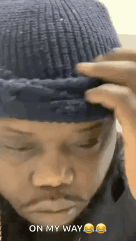 Man in Blue Beanie Making Funny Face On My Way