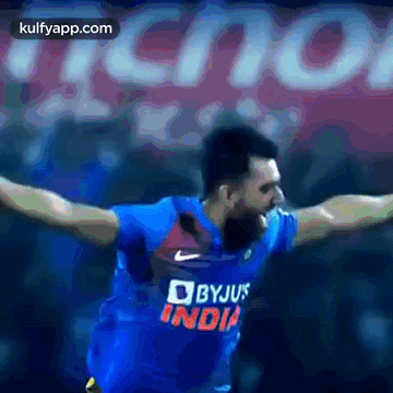 Man In Blue Byju's India Jersey Arms Outstretched GIF