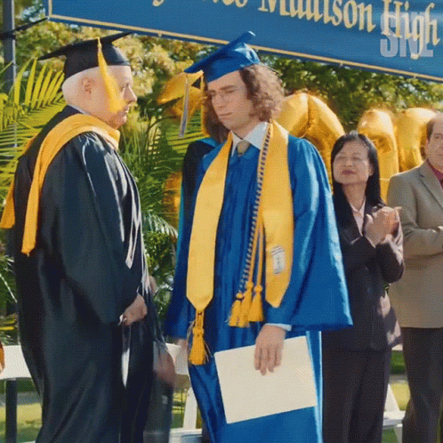 Man in Blue Cap and Gown
