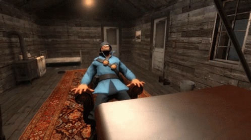 Man In Blue Coat Sitting In Chair GIF