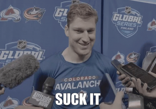 Man in Blue Colorado Avalanche Shirt Being Interviewed