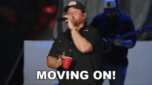 Man in Blue Columbia Shirt on Boat