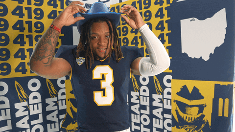 Man in Blue Cowboy Hat and Jersey Number 3