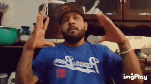 Man in Blue Dodgers Shirt Making Heart