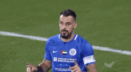 Man in Blue Emirates Islamic Jersey