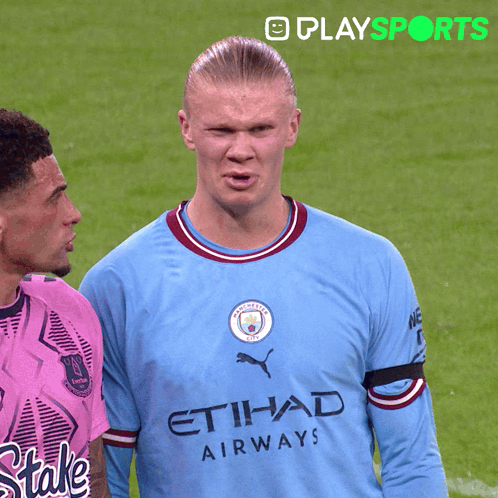 Man in Blue Etihad Airways Jersey on Soccer Field