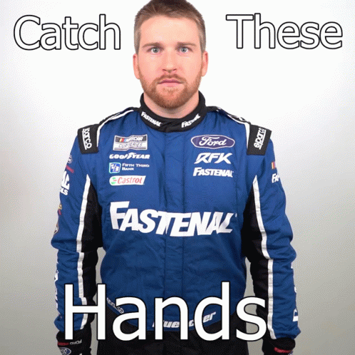 Man in Blue Fastenal Jacket and Catch These Hands Sign