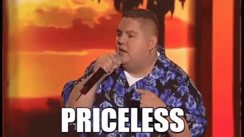 Man in Blue Floral Shirt Singing Into Microphone