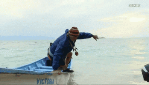 Man in Blue Givova Jacket in Boat