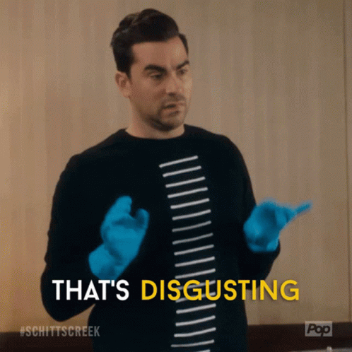 Man in Blue Gloves Saying Disgusting