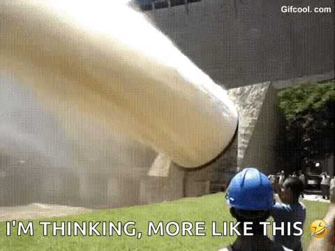 Man In Blue Hard Hat Standing By Pipe GIF