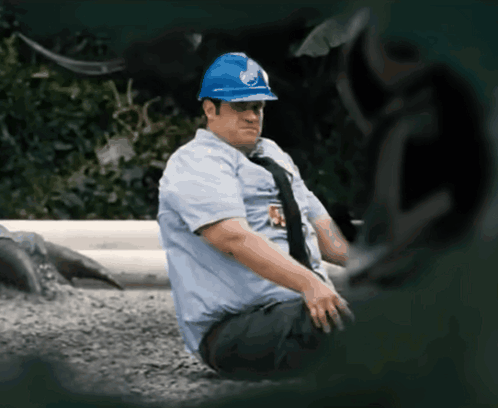 Man In Blue Hard Hat With R Badge GIF