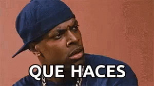 Man in Blue Hat and Blue Shirt Making Funny Face Saying Que Haces