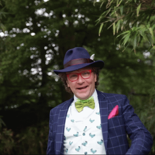 Man in Blue Hat and Glasses Smiling