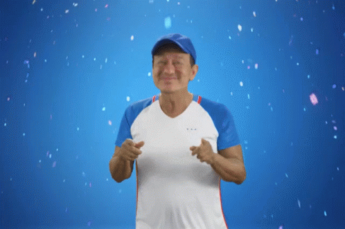 Man In Blue Hat And White Shirt Smiling GIF