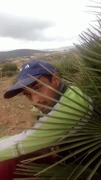 Man in Blue Hat with L