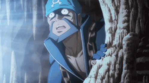 Man in Blue Hat With Letter A Standing in Cave