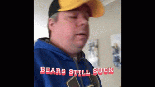 Man in Blue Hoodie and Yellow Hat Says Bears Still Suck