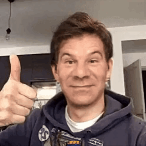 Man in Blue Hoodie Giving Thumbs Up