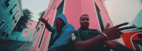 Man In Blue Hoodie Next To Man
