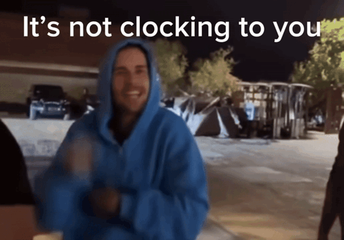 Man In Blue Hoodie Standing Before Sign GIF