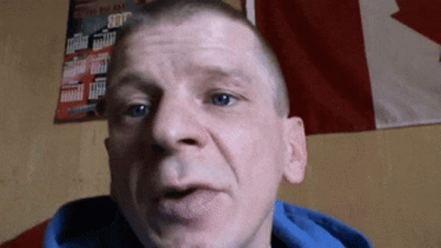 Man In Blue Hoodie With Canadian Flag GIF