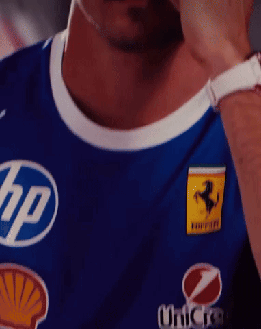 Man in Blue HP Ferrari Shirt