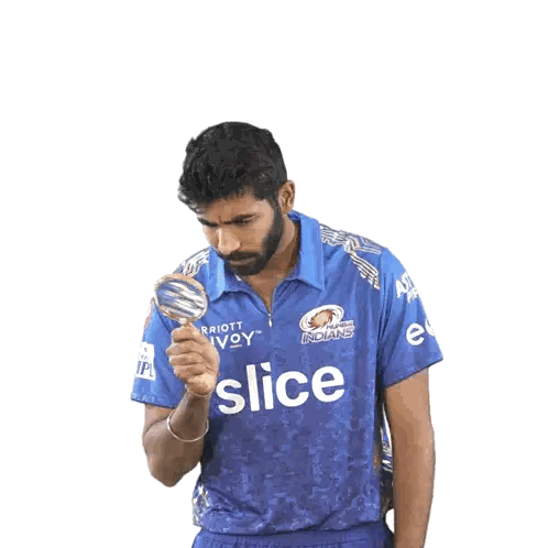 Man in Blue Indians Shirt With Magnifying Glass
