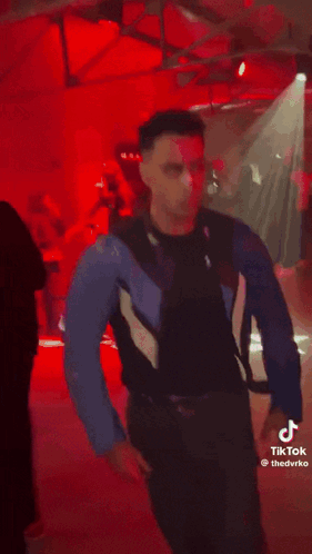 Man in Blue Jacket and Black Shirt