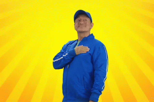 Man in Blue Jacket and Hat Hand on Heart
