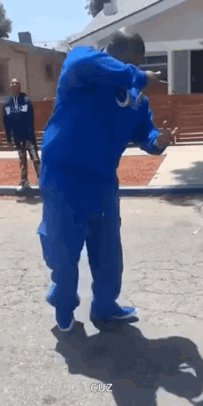 Man in Blue Jacket and Pants