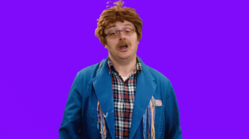 Man in Blue Jacket and Plaid Making Face