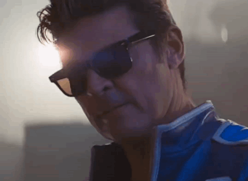 Man in Blue Jacket and Sunglasses