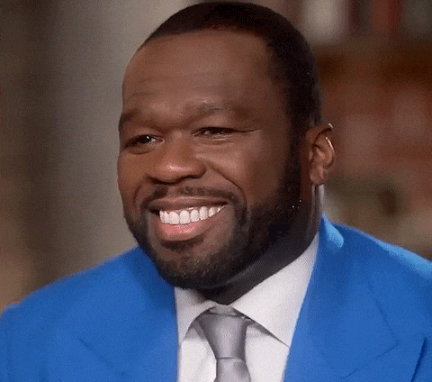 Man in Blue Jacket and Tie Smiles