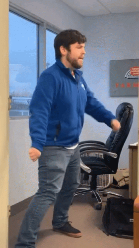 Man in Blue Jacket Dancing