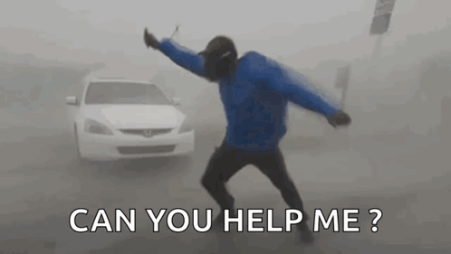 Man in Blue Jacket Dancing in Fog