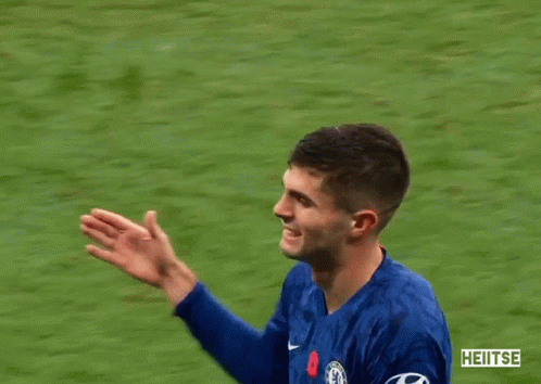 Man In Blue Jacket Hugging Man In Blue Shirt Number 10 GIF
