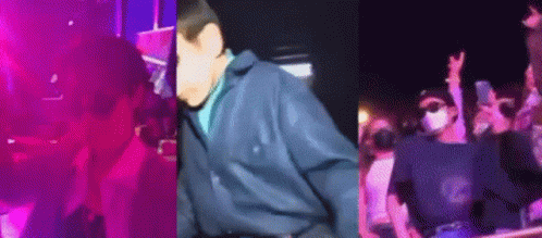 Man In Blue Jacket In Front Of Crowd GIF