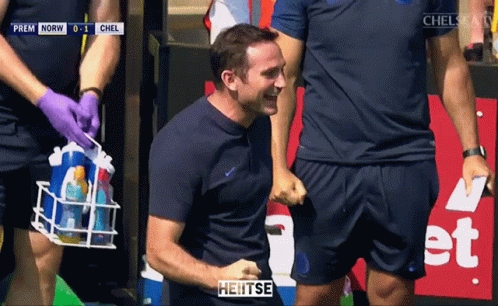 Man In Blue Jacket In Front Of Crowd Saying Heitse GIF