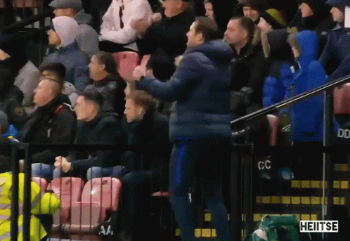 Man In Blue Jacket In Front Of Crowd With Heitse GIF
