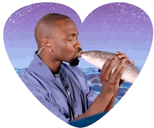 Man in Blue Jacket Kissing Fish