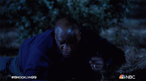 Man in Blue Jacket Lying on Ground Brooklyn99