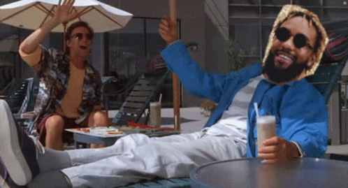 Man in Blue Jacket Lying on Lawn Chair Legs Crossed