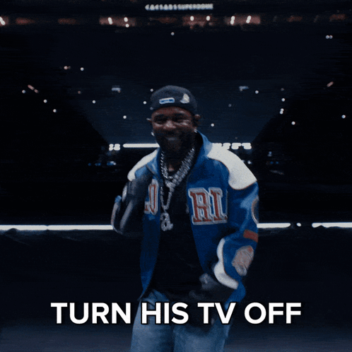 Man in Blue Jacket Pointing at Camera Turn His TV Off