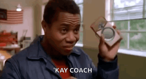 Man in Blue Jacket Saying Kay Coach
