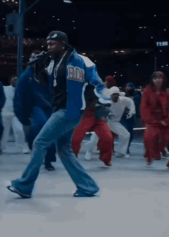 Man In Blue Jacket Singing Into Microphone GIF